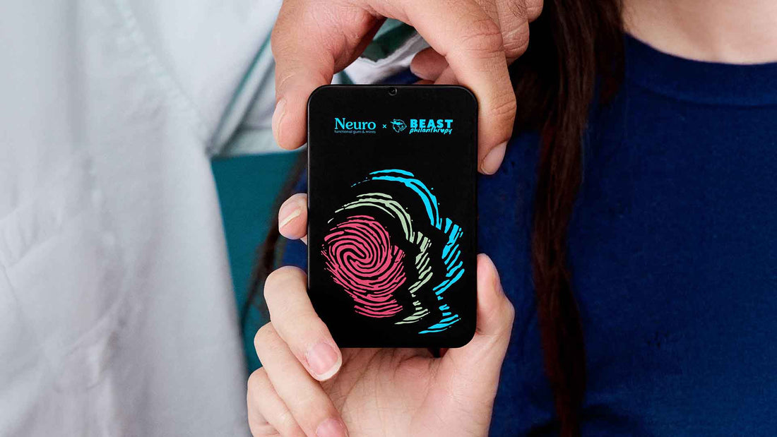 Woman holding a Neuro x Beast Philanthropy partnership tin